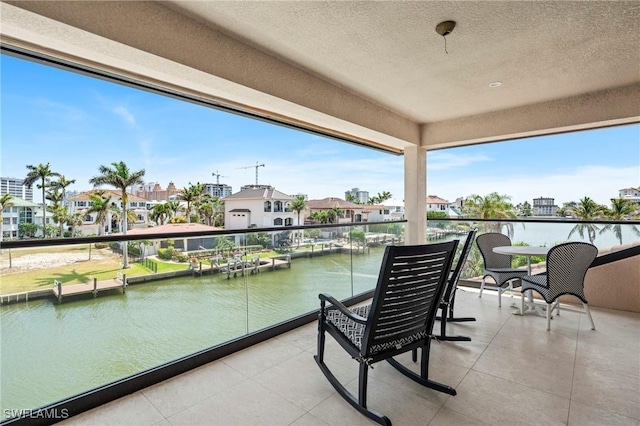 388 Pine Ave, Naples, FL 34108 - balcony with a water view and a residential view
