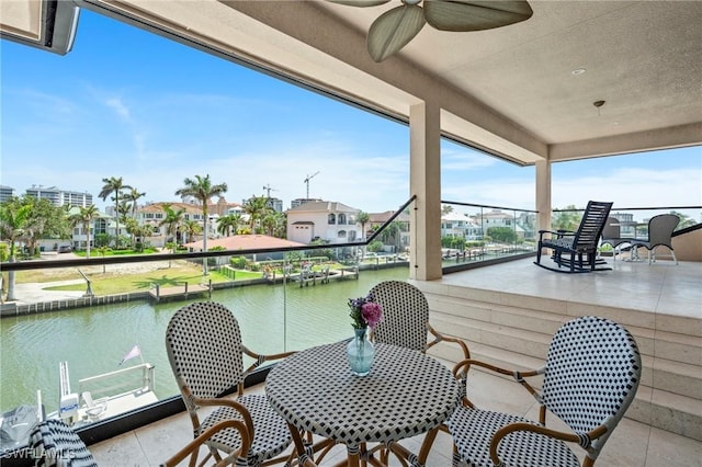 388 Pine Ave, Naples, FL 34108 - balcony featuring a ceiling fan, a water view, a residential view, and outdoor dining space