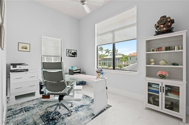 388 Pine Ave, Naples, FL 34108 - home office with a ceiling fan and light marble finish floors