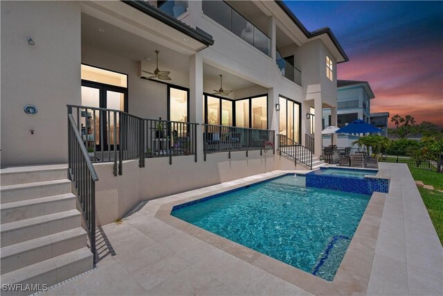 388 Pine Ave, Naples, FL 34108 - view of swimming pool featuring a ceiling fan, a patio, and a pool with connected hot tub