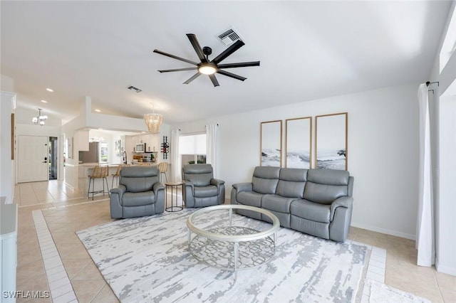 living room with light tile patterned flooring, ceiling fan, recessed lighting, and baseboards