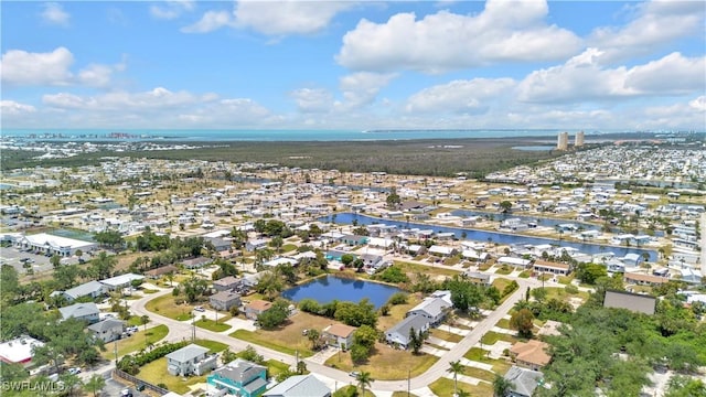 aerial overview of property's location featuring a large body of water and nearby suburban area