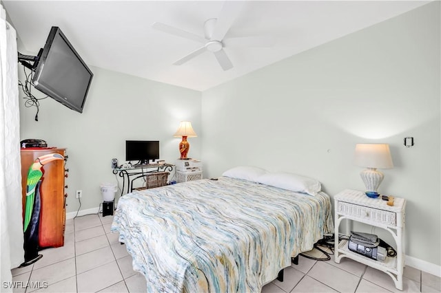 bedroom with light tile patterned flooring, baseboards, and a ceiling fan