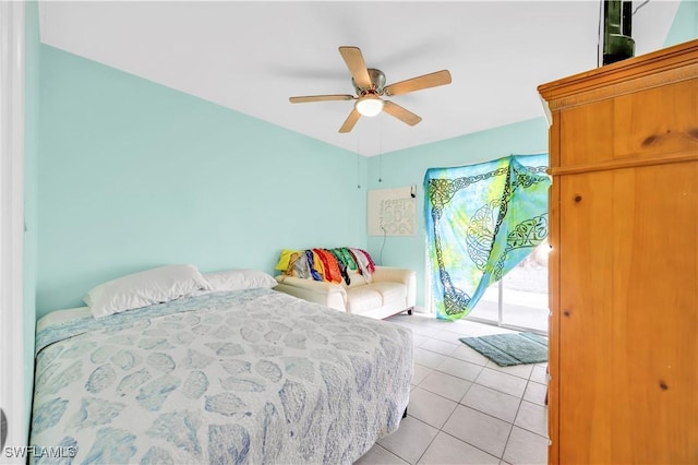 bedroom with light tile patterned floors, access to outside, and a ceiling fan