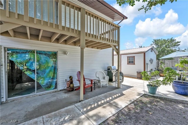 view of patio / terrace featuring an outbuilding and area for grilling