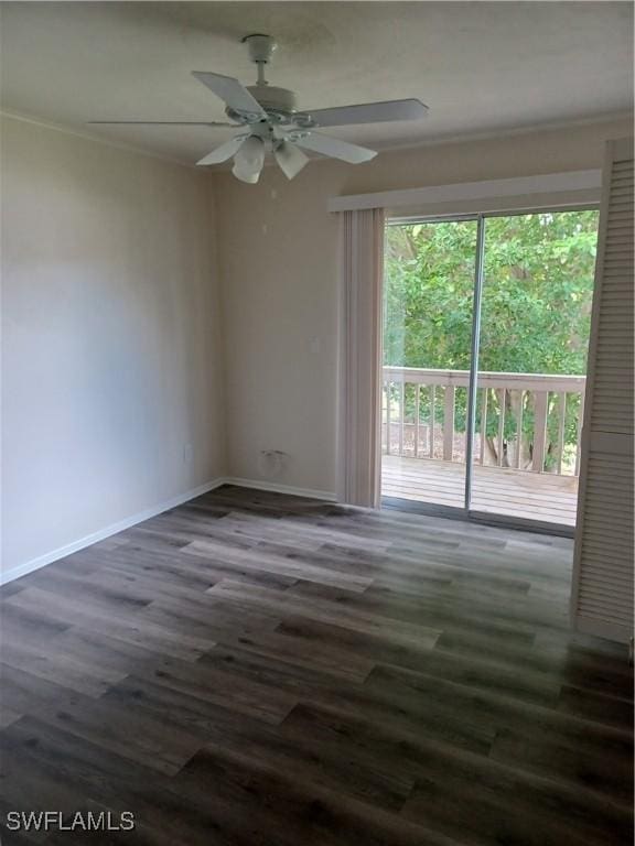 unfurnished room with ceiling fan, dark wood-style flooring, and baseboards