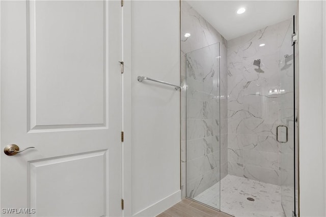 44287 Panther Dr, Punta Gorda, FL 33982 - full bath with a marble finish shower, baseboards, recessed lighting, and wood finished floors