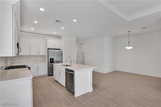 44287 Panther Dr, Punta Gorda, FL 33982 - kitchen with stainless steel appliances, a sink, light countertops, decorative backsplash, and recessed lighting