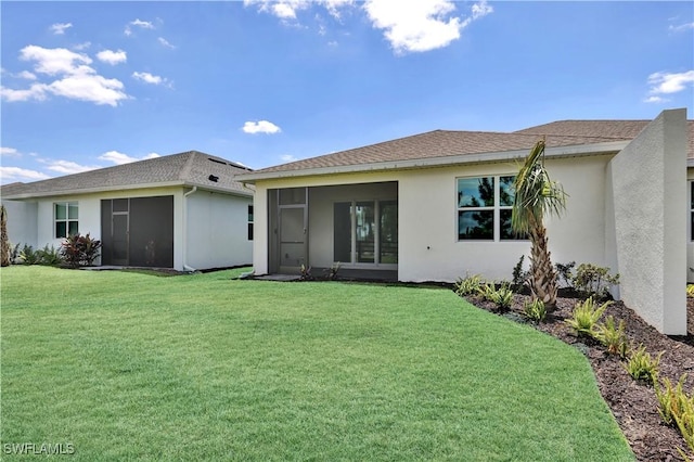 44287 Panther Dr, Punta Gorda, FL 33982 - back of property featuring a sunroom, stucco siding, and a lawn