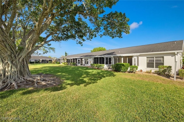 6861 Bogey Dr, Fort Myers, FL 33919 - rear view of house featuring a yard and stucco siding