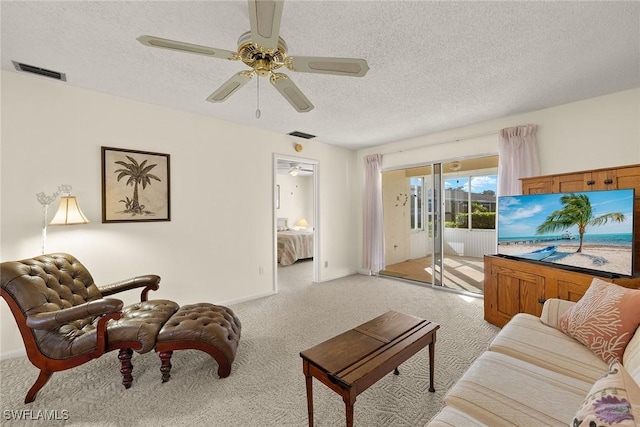 6861 Bogey Dr, Fort Myers, FL 33919 - living area featuring light carpet, a ceiling fan, a textured ceiling, and baseboards