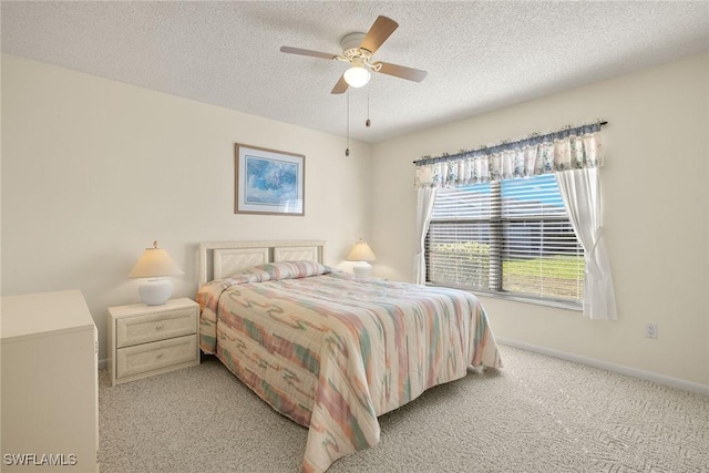 6861 Bogey Dr, Fort Myers, FL 33919 - bedroom with carpet, a textured ceiling, baseboards, and ceiling fan