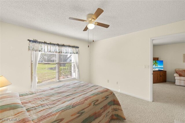 6861 Bogey Dr, Fort Myers, FL 33919 - carpeted bedroom featuring a textured ceiling and ceiling fan