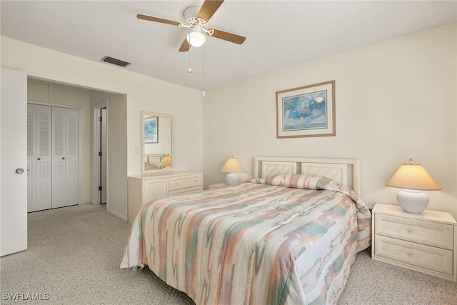 6861 Bogey Dr, Fort Myers, FL 33919 - bedroom with light colored carpet, a textured ceiling, and a ceiling fan