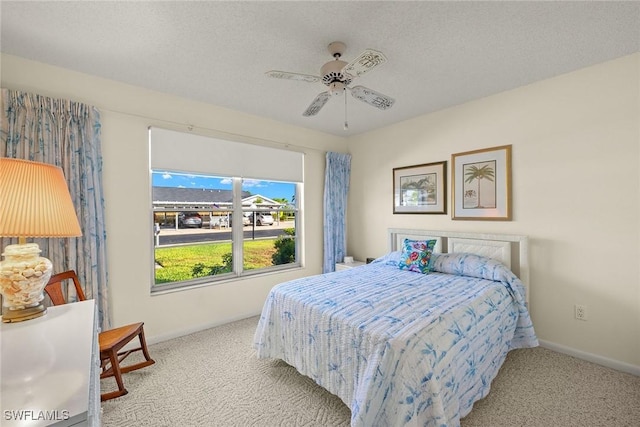 6861 Bogey Dr, Fort Myers, FL 33919 - bedroom featuring carpet flooring, baseboards, ceiling fan, and a textured ceiling
