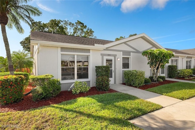 6861 Bogey Dr, Fort Myers, FL 33919 - ranch-style home featuring a front yard and stucco siding