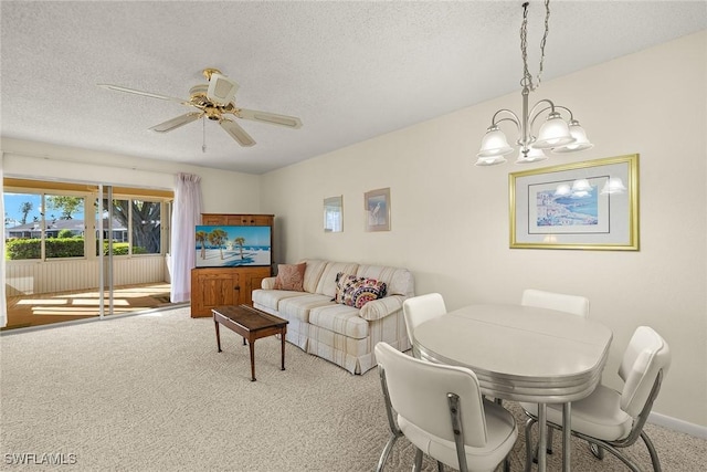 6861 Bogey Dr, Fort Myers, FL 33919 - dining space with carpet floors, a chandelier, a textured ceiling, a ceiling fan, and baseboards