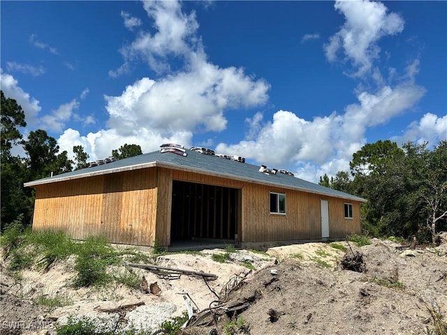 1305 W 18th St, Lehigh Acres, FL 33972 - back of property featuring a detached garage