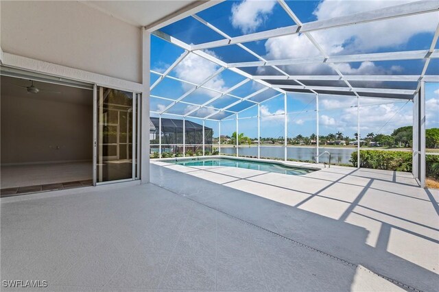 1526 Vintage Ln, Naples, FL 34104 - swimming pool with a patio, a water view, and glass enclosure