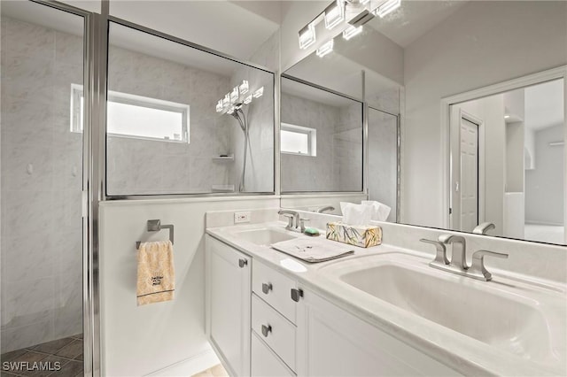 1526 Vintage Ln, Naples, FL 34104 - bathroom featuring double vanity and a tile shower