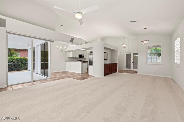 1526 Vintage Ln, Naples, FL 34104 - unfurnished living room featuring a chandelier, light carpet, baseboards, lofted ceiling, and ceiling fan