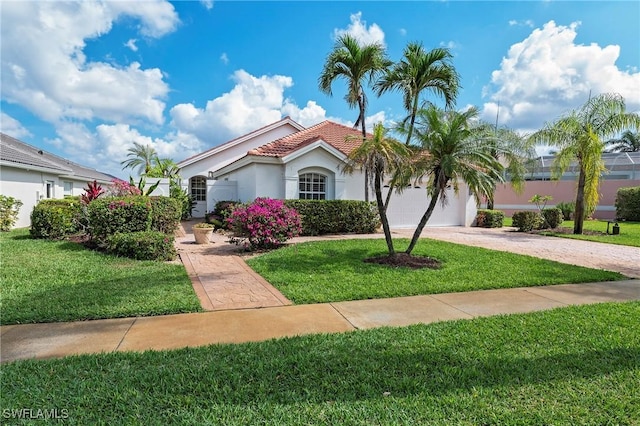 1526 Vintage Ln, Naples, FL 34104 - mediterranean / spanish-style home with stucco siding, driveway, a tile roof, a front lawn, and a garage