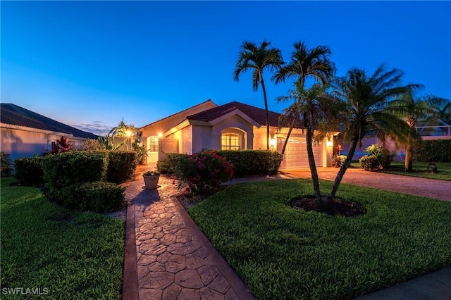 1526 Vintage Ln, Naples, FL 34104 - view of front of house with dirt driveway, stucco siding, an attached garage, and a lawn