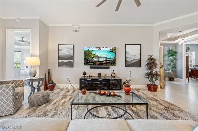9380 Triana Ter Unit 312, Fort Myers, FL 33912 - living room with a ceiling fan, baseboards, ornamental molding, and tile patterned flooring