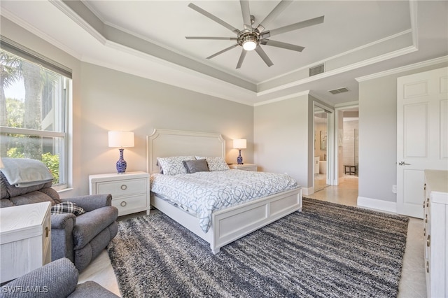 9380 Triana Ter Unit 312, Fort Myers, FL 33912 - bedroom featuring a raised ceiling, multiple windows, ornamental molding, baseboards, and a ceiling fan