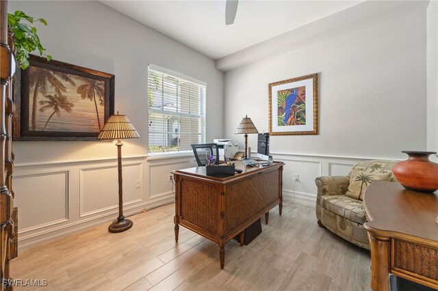 9380 Triana Ter Unit 312, Fort Myers, FL 33912 - office featuring a decorative wall, wainscoting, ceiling fan, and light wood-type flooring