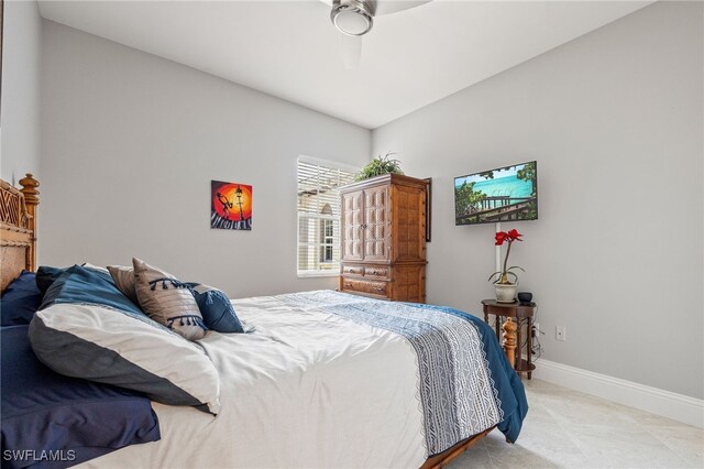 9380 Triana Ter Unit 312, Fort Myers, FL 33912 - bedroom with baseboards, light carpet, and a ceiling fan