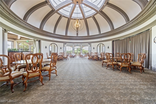 9380 Triana Ter Unit 312, Fort Myers, FL 33912 - dining space featuring a high ceiling, carpet floors, healthy amount of natural light, crown molding, and a chandelier