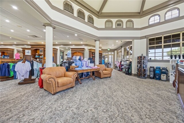 9380 Triana Ter Unit 312, Fort Myers, FL 33912 - carpeted living area with ornate columns and a towering ceiling
