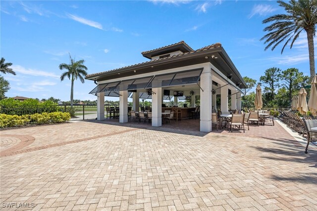9380 Triana Ter Unit 312, Fort Myers, FL 33912 - view of patio with a gazebo and outdoor dining area