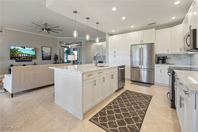 9380 Triana Ter Unit 312, Fort Myers, FL 33912 - kitchen with stainless steel appliances, a sink, crown molding, recessed lighting, and tasteful backsplash