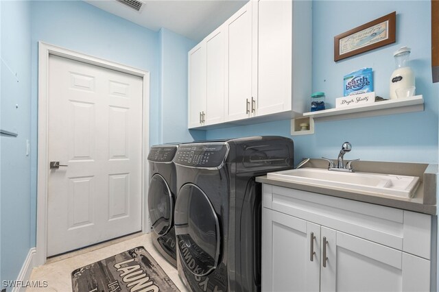 9380 Triana Ter Unit 312, Fort Myers, FL 33912 - laundry room featuring washer and clothes dryer and cabinet space