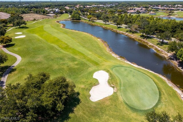 9380 Triana Ter Unit 312, Fort Myers, FL 33912 - aerial view of property and surrounding area featuring a nearby body of water, a golf course, and a tree filled landscape