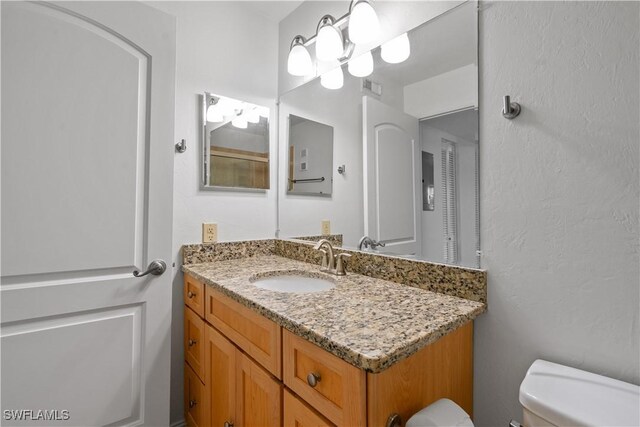 3160 Seasons Way Unit 709, Estero, FL 33928 - half bath with toilet, vanity, and visible vents