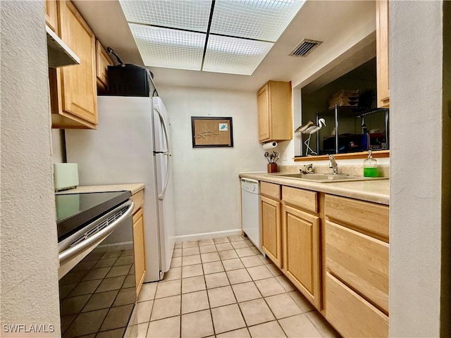 3706 Broadway Unit 18, Fort Myers, FL 33901 - kitchen with electric range oven, a sink, light brown cabinets, and light tile patterned flooring