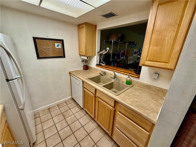 3706 Broadway Unit 18, Fort Myers, FL 33901 - kitchen featuring a sink, white appliances, light tile patterned floors, light countertops, and baseboards