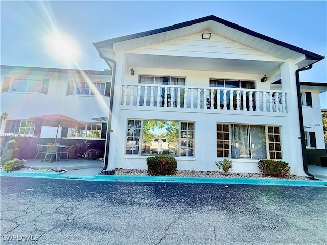 3706 Broadway Unit 18, Fort Myers, FL 33901 - rear view of property featuring a balcony and stucco siding