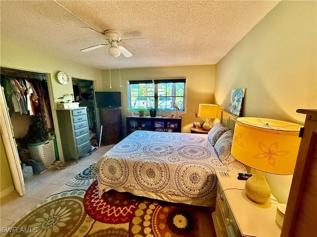 3706 Broadway Unit 18, Fort Myers, FL 33901 - bedroom featuring ceiling fan, a textured ceiling, and light tile patterned floors