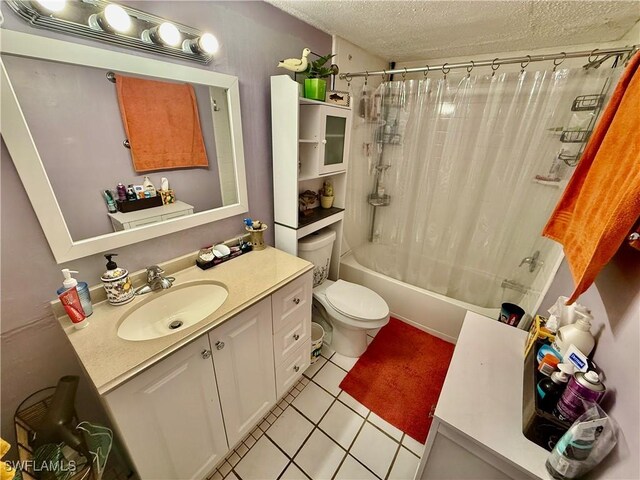 3706 Broadway Unit 18, Fort Myers, FL 33901 - bathroom with a textured ceiling, tile patterned flooring, toilet, shower / bath combination with curtain, and vanity