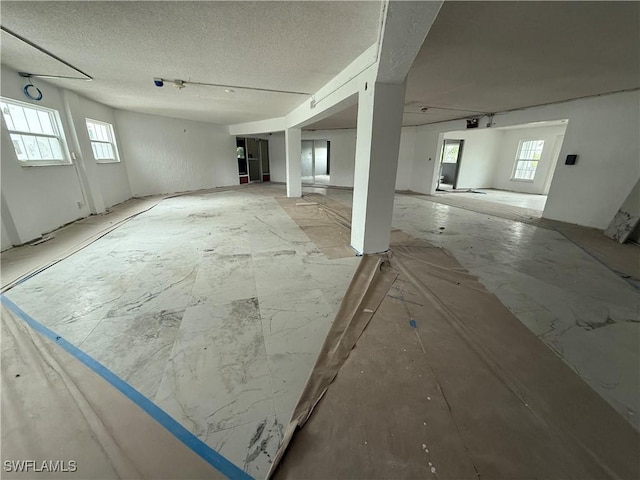 3706 Broadway Unit 18, Fort Myers, FL 33901 - unfurnished living room with a textured ceiling