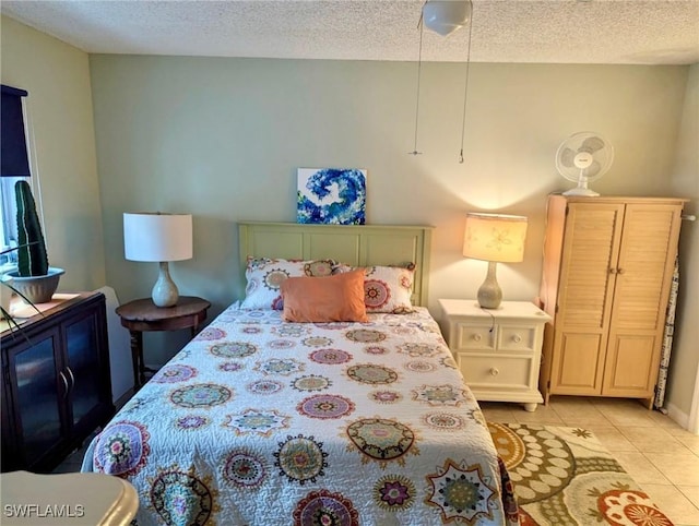 3706 Broadway Unit 18, Fort Myers, FL 33901 - bedroom featuring light tile patterned floors and a textured ceiling