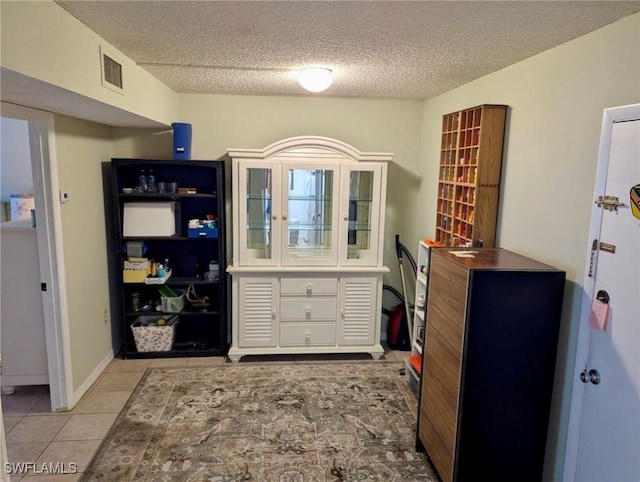 3706 Broadway Unit 18, Fort Myers, FL 33901 - home office featuring a textured ceiling and light tile patterned flooring