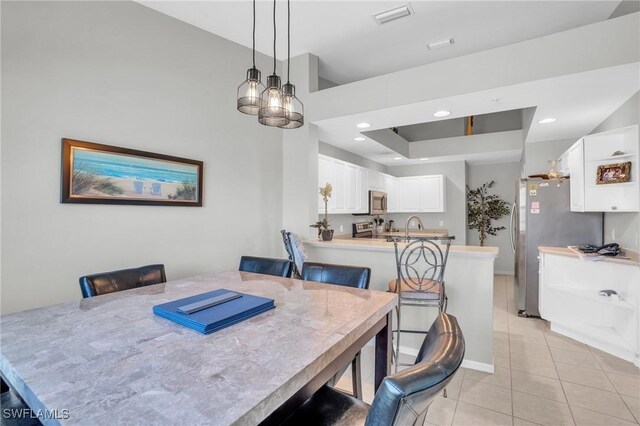 3435 Laurel Greens Ln S Unit 202, Naples, FL 34119 - dining space featuring light tile patterned flooring, a chandelier, and recessed lighting