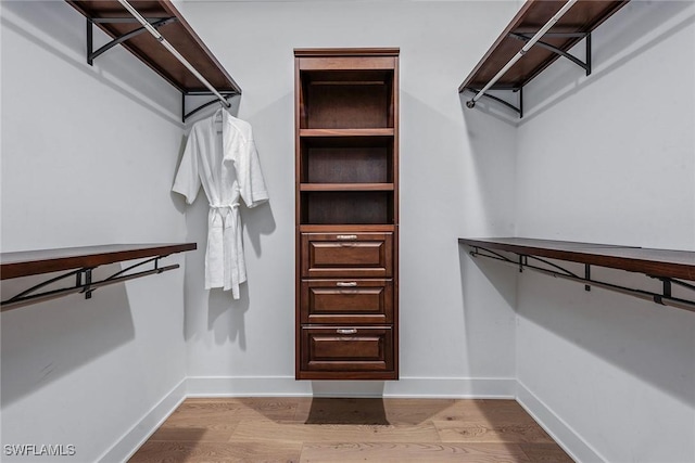 spacious closet featuring wood finished floors