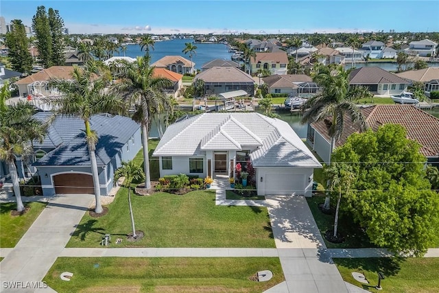 aerial perspective of suburban area with a large body of water