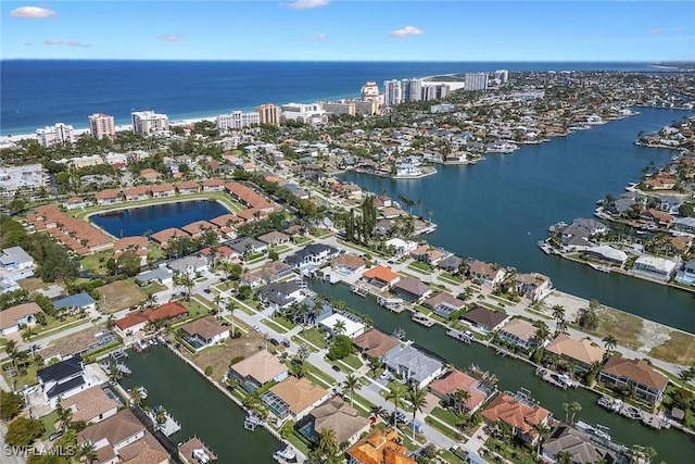 aerial overview of property's location featuring a large body of water and nearby suburban area